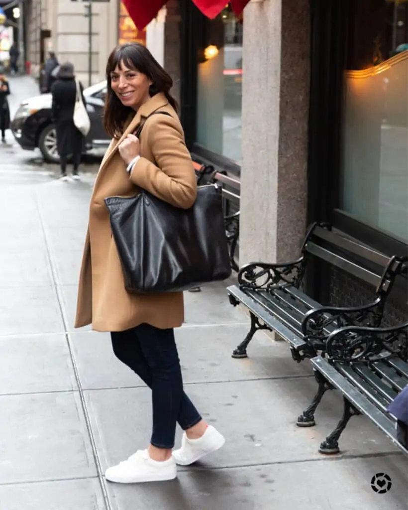 woman wearing coat and sharing what to pack in Paris for fall woman wearing coat and sharing what to pack in Paris for fall