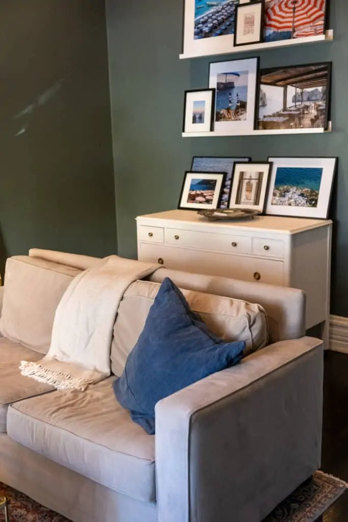 living room with sofa and framed photos living room with sofa and framed photos