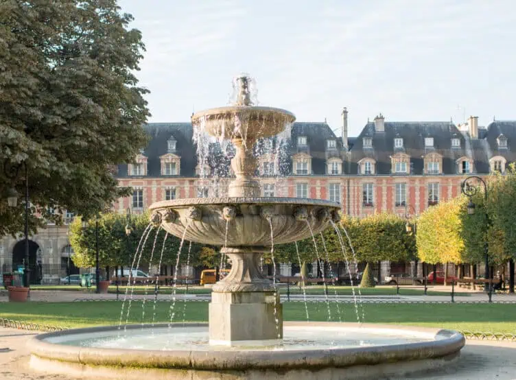 Paris in the fall. Place des Vosges fountain